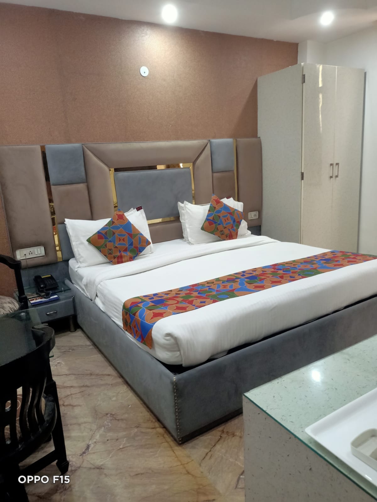 Deluxe Room — double bed with padded headboard