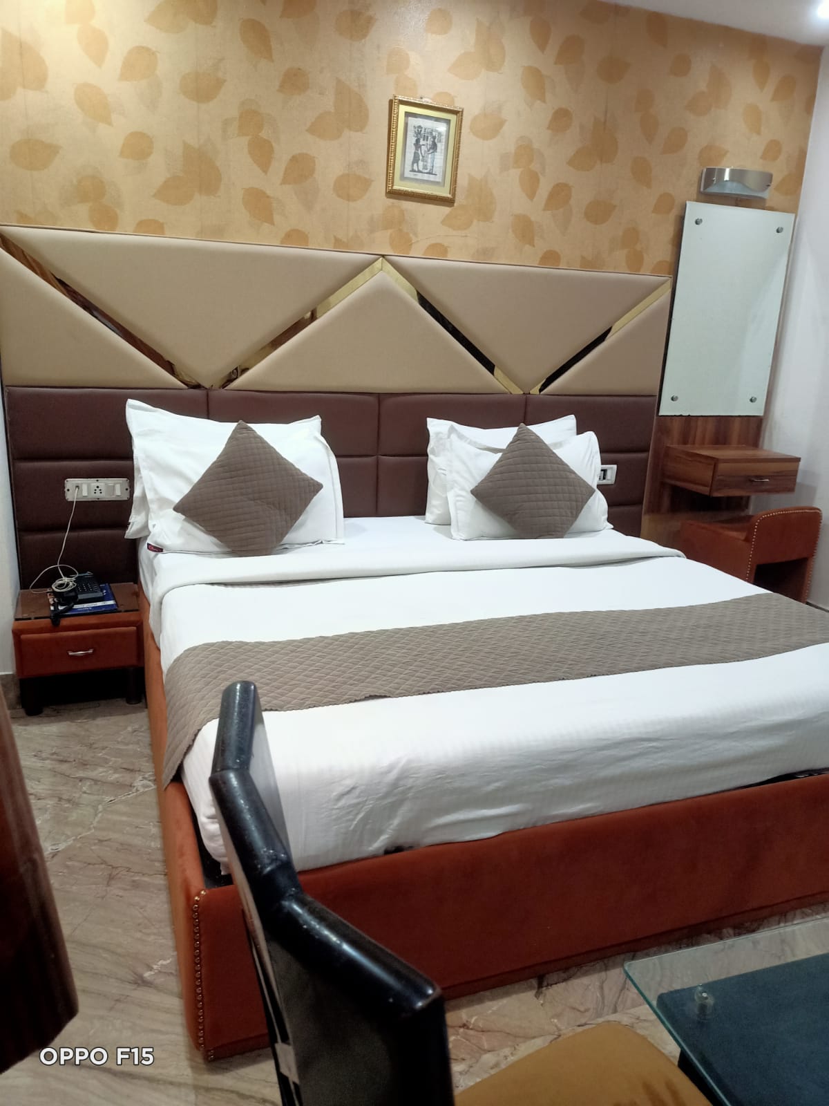 Deluxe Room — double bed with cream diamond headboard