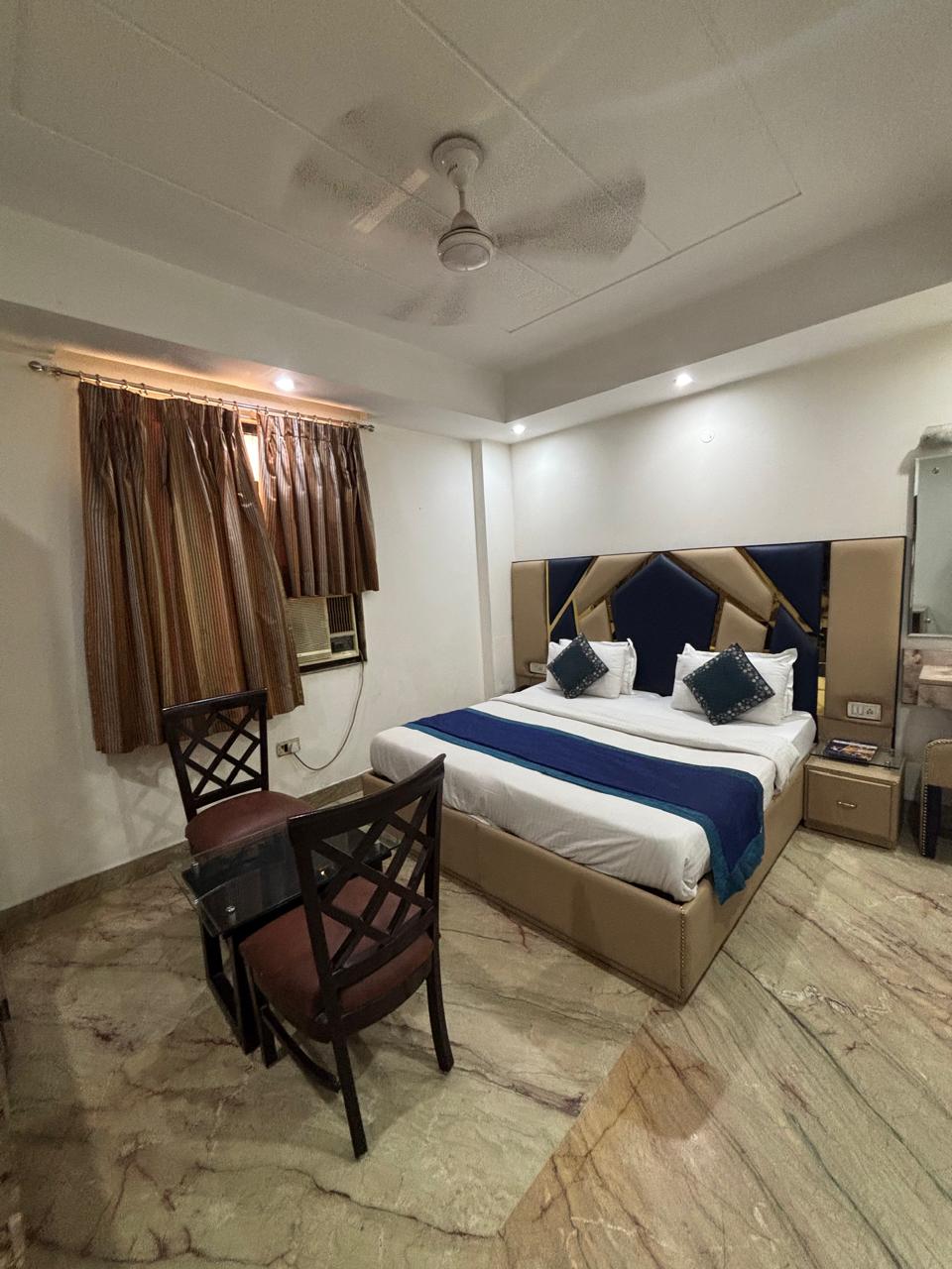 Guest room with blue décor, alternate view